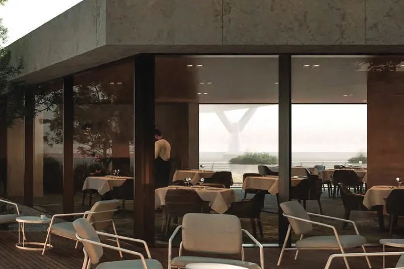 Canalside restaurant with timber deck terrace and lounge chairs
